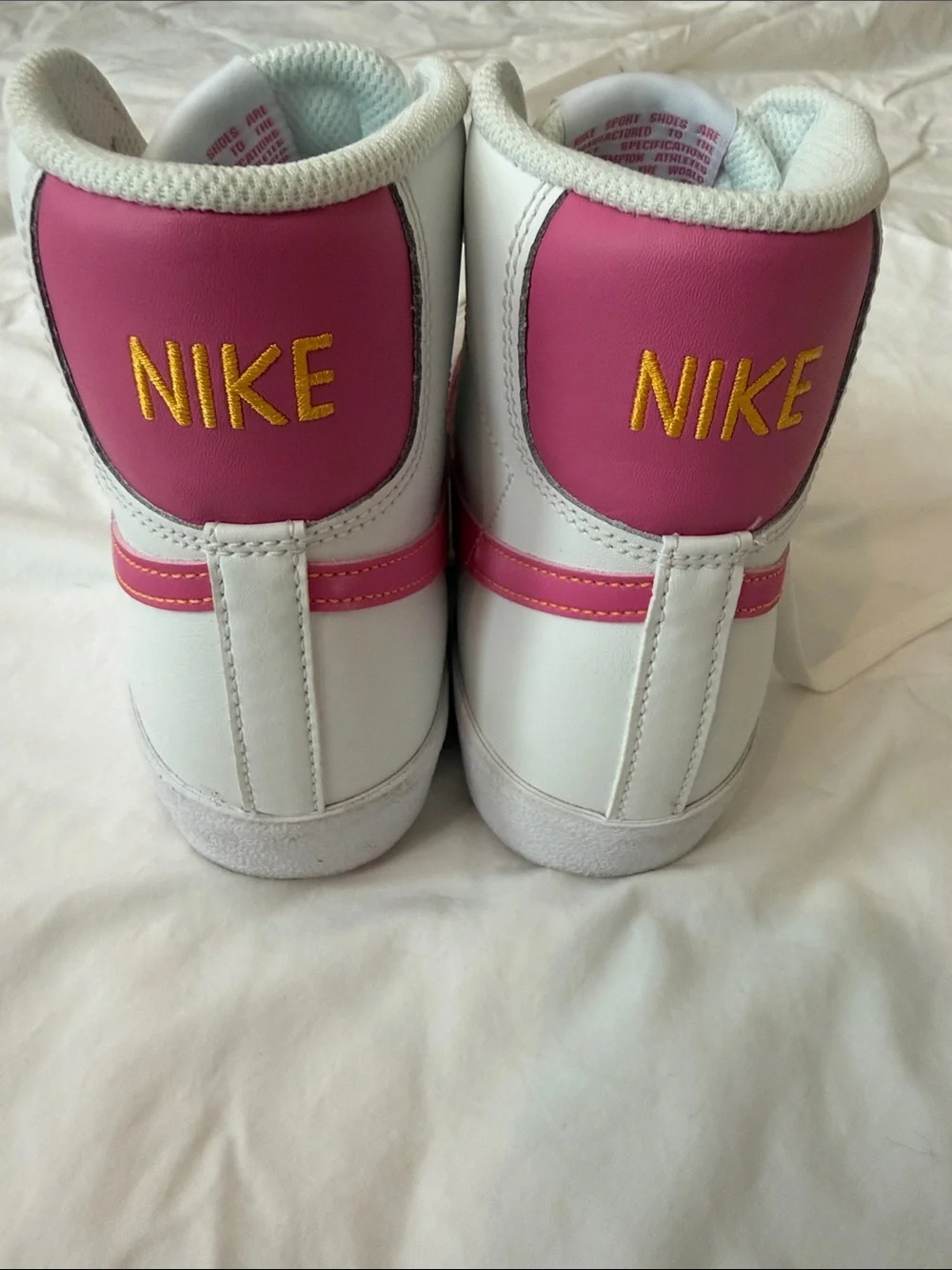 Nike Blazers High-Top Sneakers with Pink Swoosh Accents and Yellow “Nike”